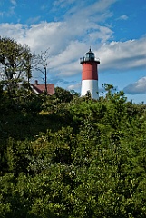 Nauset Lighthouse on Hilltop Surrounded by Evergreens